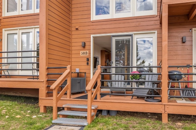 property entrance with a wooden deck