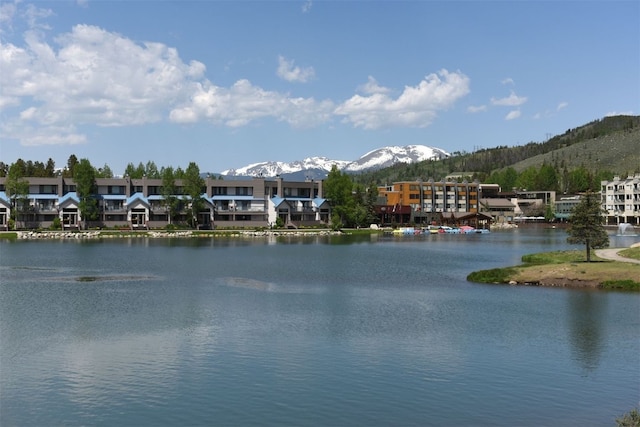 water view featuring a residential view and a mountain view