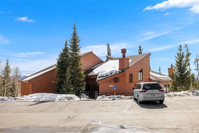view of side of property featuring a chimney