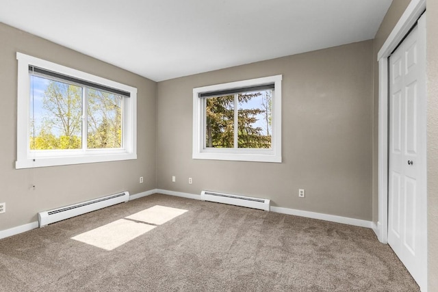 485 Amethyst Dr, Steamboat Springs, CO 80487 - unfurnished bedroom featuring a baseboard heating unit, carpet, and baseboards