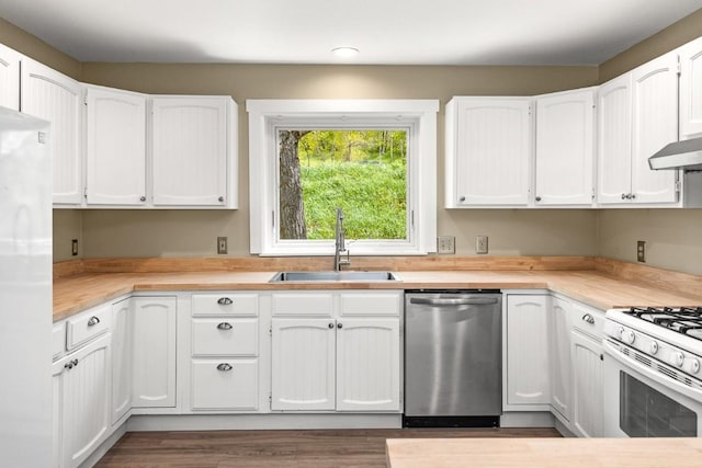 485 Amethyst Dr, Steamboat Springs, CO 80487 - kitchen featuring stainless steel dishwasher, a sink, refrigerator, light countertops, and white cabinetry
