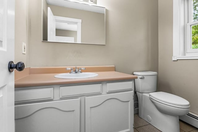 485 Amethyst Dr, Steamboat Springs, CO 80487 - bathroom featuring a baseboard heating unit, vanity, and toilet