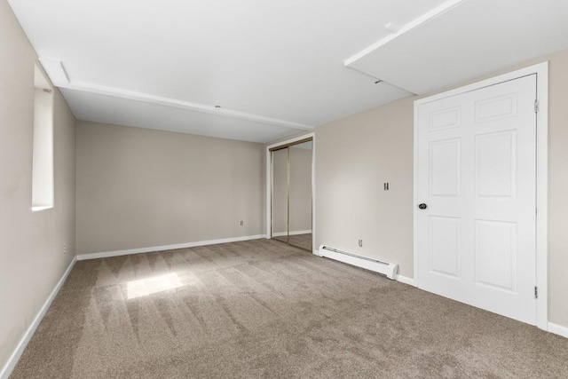 485 Amethyst Dr, Steamboat Springs, CO 80487 - unfurnished bedroom with a baseboard heating unit, carpet, baseboards, and a closet