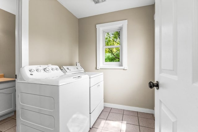 485 Amethyst Dr, Steamboat Springs, CO 80487 - washroom with washer and dryer, baseboards, and light tile patterned floors