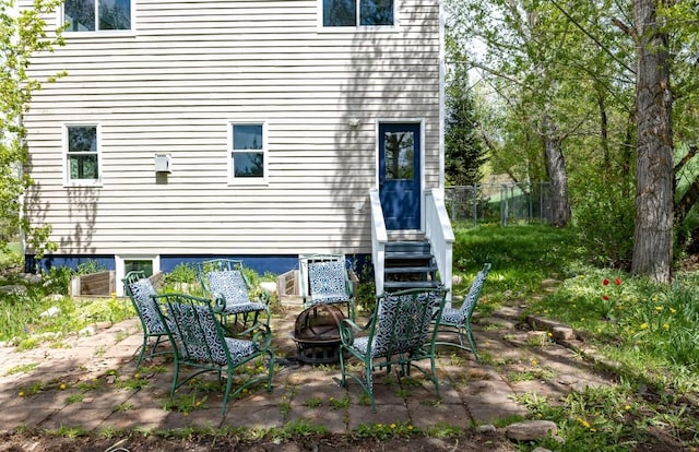 485 Amethyst Dr, Steamboat Springs, CO 80487 - rear view of house with an outdoor fire pit and a patio