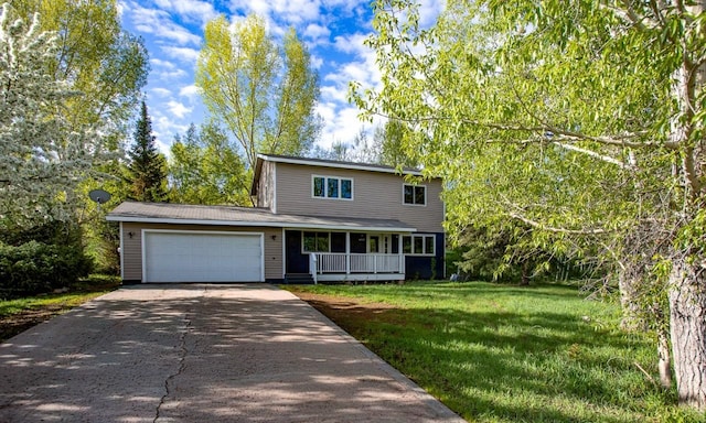 485 Amethyst Dr, Steamboat Springs, CO 80487 - traditional-style home featuring driveway, an attached garage, a front yard, and covered porch