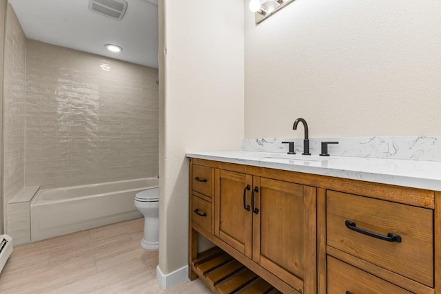 485 Amethyst Dr, Steamboat Springs, CO 80487 - full bath featuring vanity, toilet, shower / bathtub combination, and a baseboard radiator