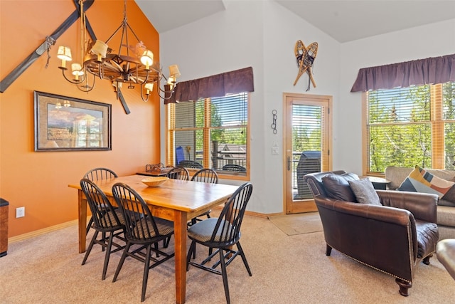 33 Broken Lance Dr Unit 207S, Breckenridge, CO 80424 - dining area featuring a chandelier, light colored carpet, and high vaulted ceiling