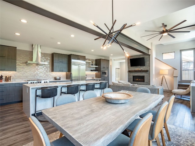 184 Caravelle Dr Unit 20, Keystone, CO 80435 - dining space featuring dark wood finished floors, recessed lighting, and a fireplace