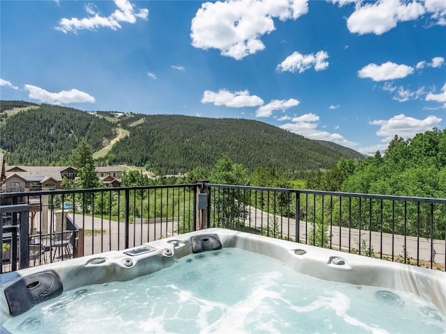 184 Caravelle Dr Unit 20, Keystone, CO 80435 - balcony with a forest view, a mountain view, and an outdoor hot tub