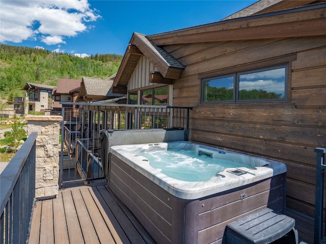 184 Caravelle Dr Unit 20, Keystone, CO 80435 - wooden terrace featuring a hot tub and a view of trees