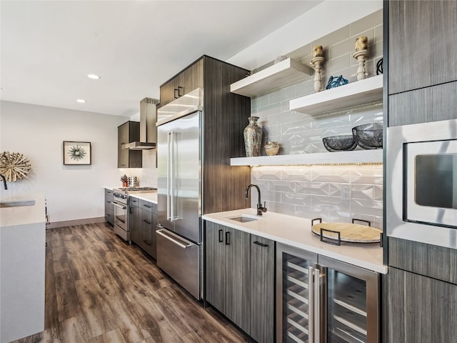 184 Caravelle Dr Unit 20, Keystone, CO 80435 - kitchen featuring high end appliances, wall chimney range hood, open shelves, tasteful backsplash, and beverage cooler