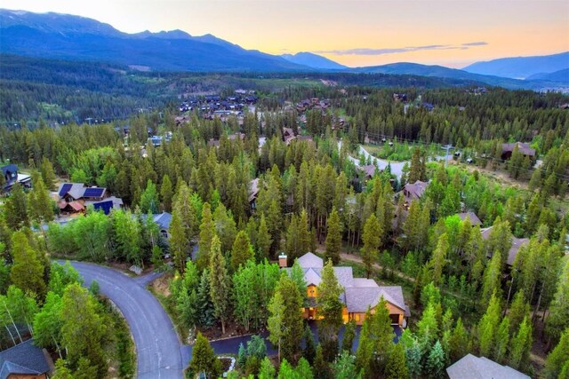 120 Windwood Cir, Breckenridge, CO 80424 - aerial view at dusk featuring a forest view and a mountain view