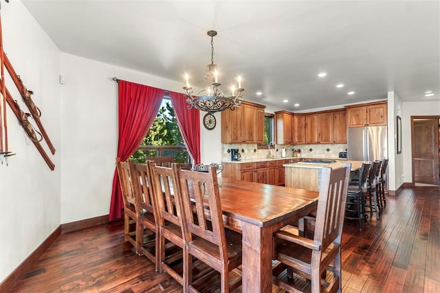 dining room with baseboards, recessed lighting, a chandelier, and dark wood finished floors