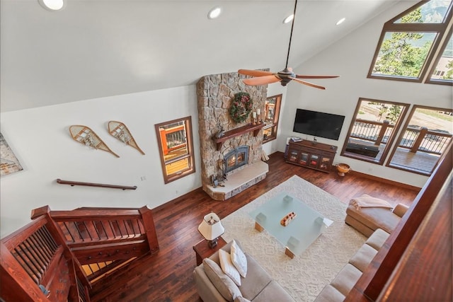 150 N Fuller Placer Rd, Breckenridge, CO 80424 - living room with recessed lighting, wood finished floors, a stone fireplace, a ceiling fan, and high vaulted ceiling