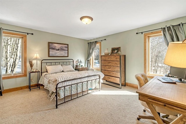 carpeted bedroom with baseboards