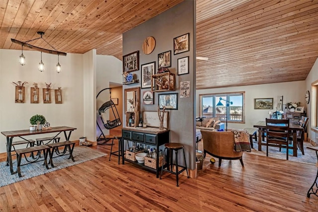 interior space with wood finished floors, lofted ceiling, and wood ceiling