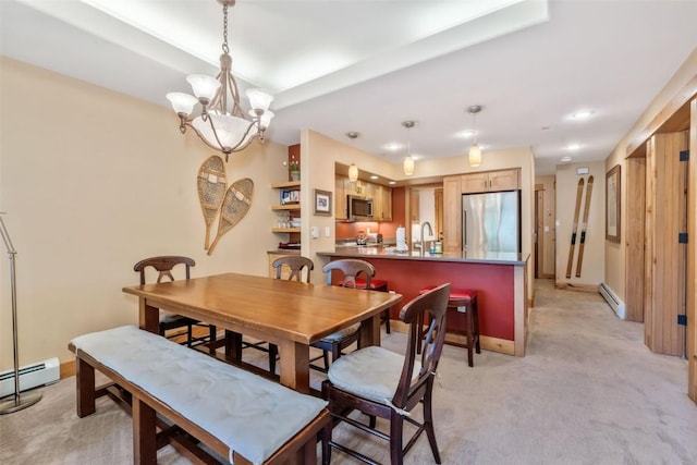 dining room featuring a baseboard radiator, light carpet, a chandelier, and recessed lighting