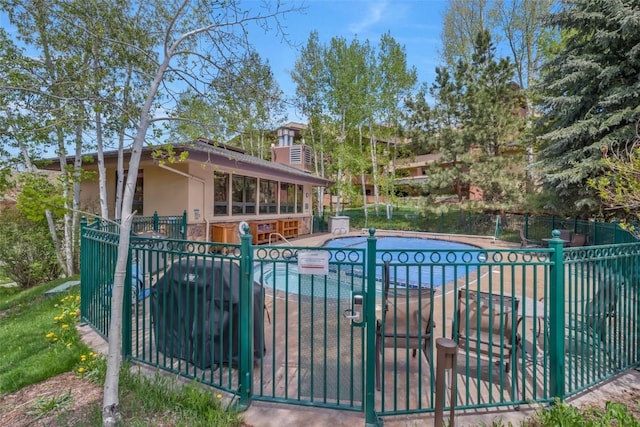 community pool with fence and a gate