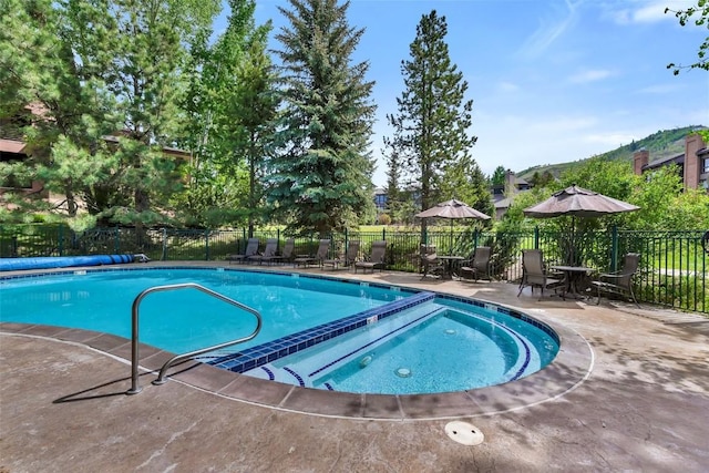 2720 Eagleridge Dr Unit 207, Steamboat Springs, CO 80487 - view of swimming pool featuring a patio area and a pool with connected hot tub