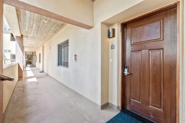 property entrance featuring stucco siding