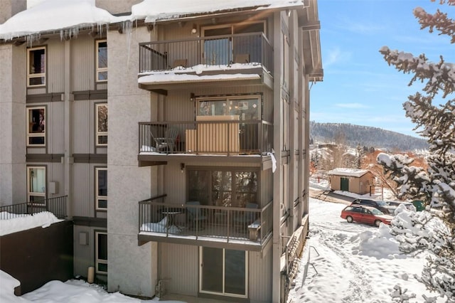 snow covered building with a mountain view