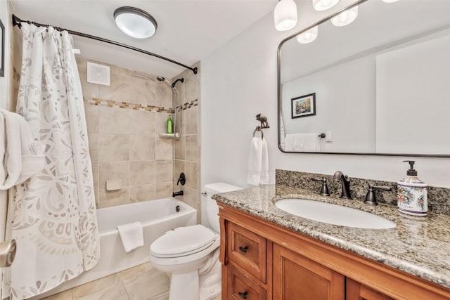 bathroom with shower / bath combo, toilet, vanity, and tile patterned floors
