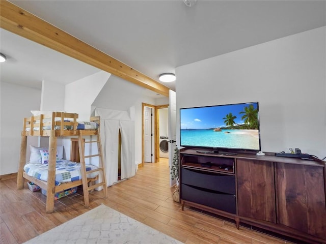 511 Fairview Blvd, Breckenridge, CO 80424 - bedroom with wood finished floors, washer / dryer, and beam ceiling