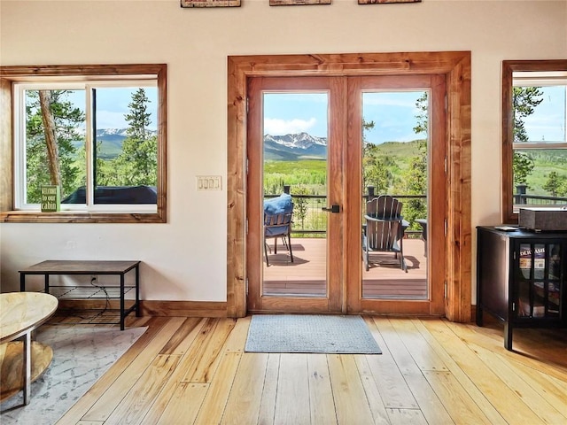 511 Fairview Blvd, Breckenridge, CO 80424 - doorway with wood-type flooring and a mountain view
