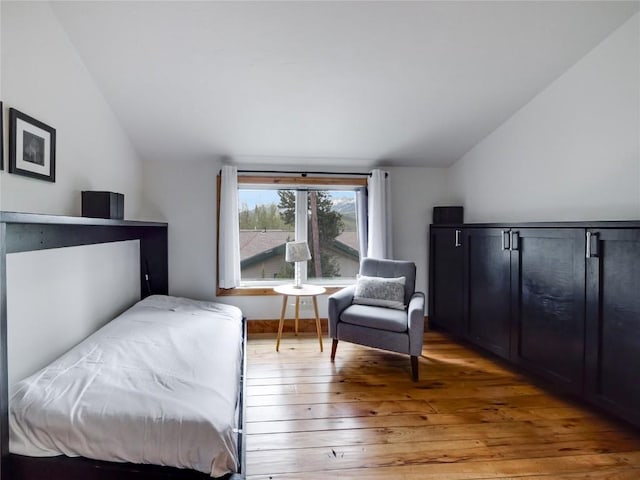511 Fairview Blvd, Breckenridge, CO 80424 - bedroom with vaulted ceiling and light wood-type flooring