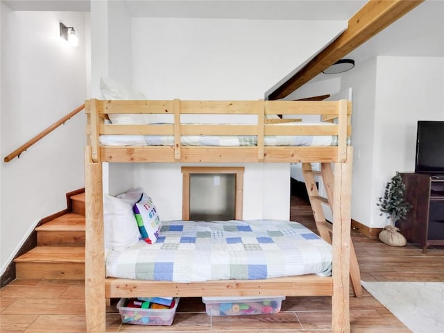 511 Fairview Blvd, Breckenridge, CO 80424 - bedroom featuring wood finished floors and beam ceiling