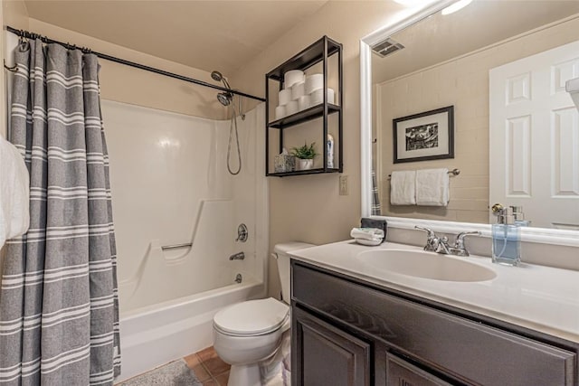 full bathroom featuring tile patterned floors, shower / bath combo, toilet, and vanity