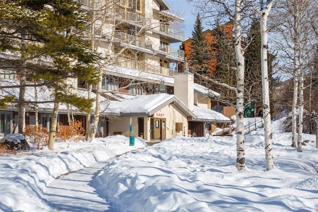 view of snow covered property