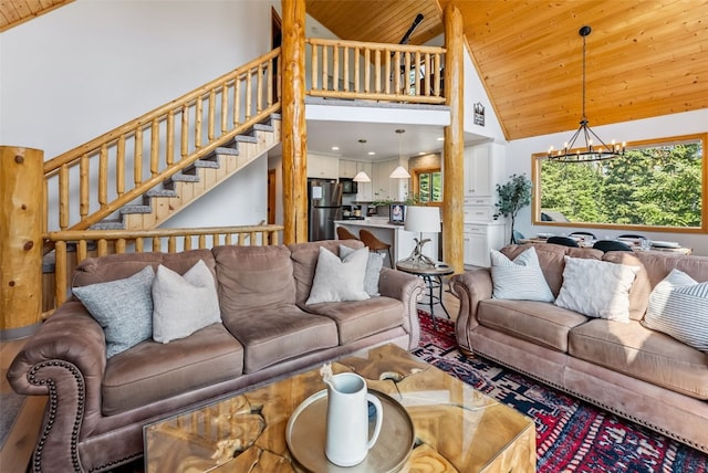 1375 Roberts Rd, Alma, CO 80440 - living area featuring wood ceiling, high vaulted ceiling, a chandelier, and stairs
