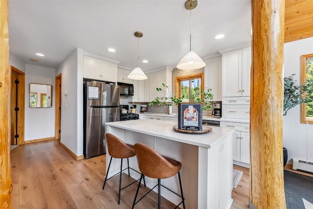 1375 Roberts Rd, Alma, CO 80440 - kitchen featuring black appliances, light countertops, white cabinets, and recessed lighting