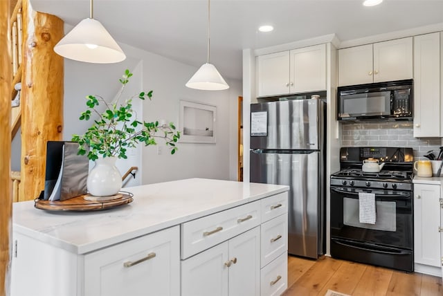 1375 Roberts Rd, Alma, CO 80440 - kitchen featuring black appliances, recessed lighting, tasteful backsplash, white cabinetry, and decorative light fixtures