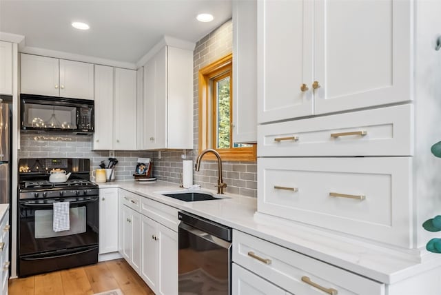 1375 Roberts Rd, Alma, CO 80440 - kitchen featuring black appliances, white cabinets, backsplash, light stone countertops, and recessed lighting