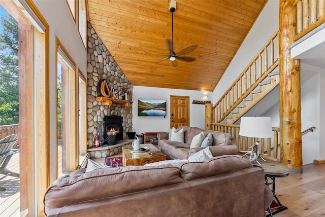 1375 Roberts Rd, Alma, CO 80440 - living room with wood finished floors, ceiling fan, wooden ceiling, a stone fireplace, and high vaulted ceiling