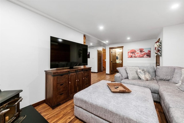 26395 County Road 33a, Steamboat Springs, CO 80487 - living room featuring light wood-style flooring, recessed lighting, baseboards, and a wood stove