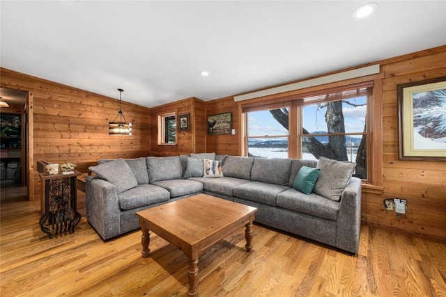 26395 County Road 33a, Steamboat Springs, CO 80487 - living room featuring wooden walls, light wood-style floors, vaulted ceiling, and recessed lighting