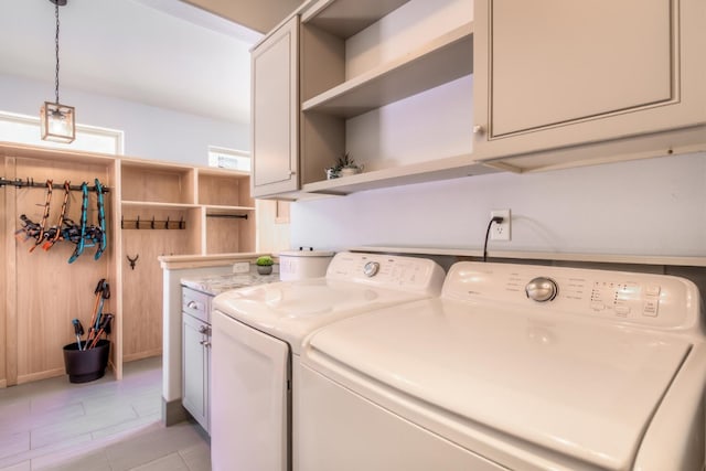 laundry area with cabinet space and washing machine and clothes dryer