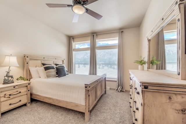 bedroom featuring a ceiling fan and light colored carpet