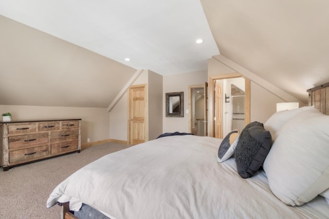 carpeted bedroom featuring recessed lighting, vaulted ceiling, ensuite bathroom, and baseboards