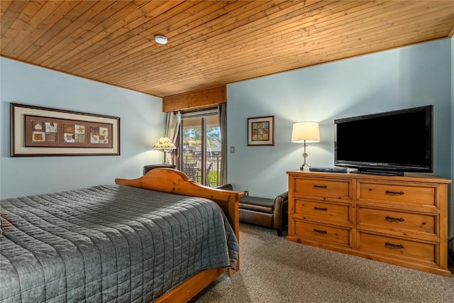 bedroom with carpet, wooden ceiling, and access to outside