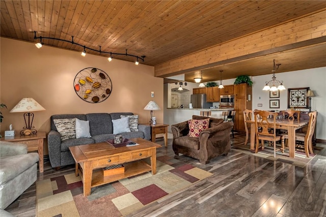 living room with a chandelier, track lighting, dark hardwood / wood-style floors, and wooden ceiling