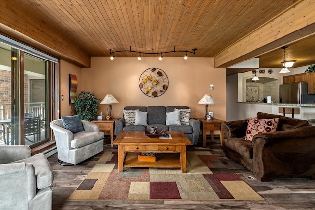 living room featuring track lighting, dark hardwood / wood-style floors, and wooden ceiling