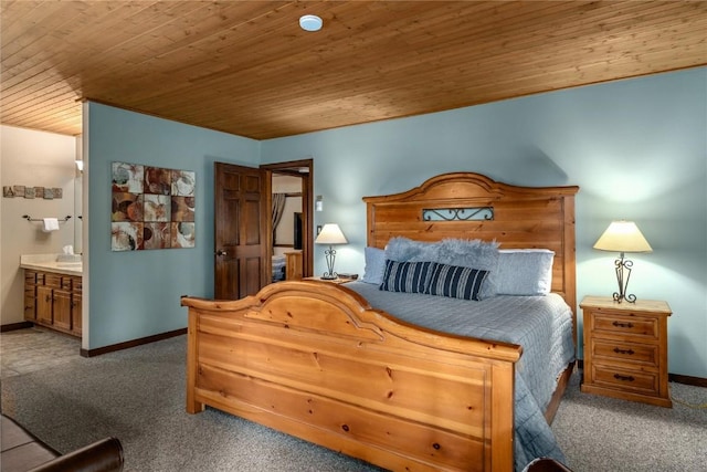 carpeted bedroom featuring connected bathroom and wood ceiling