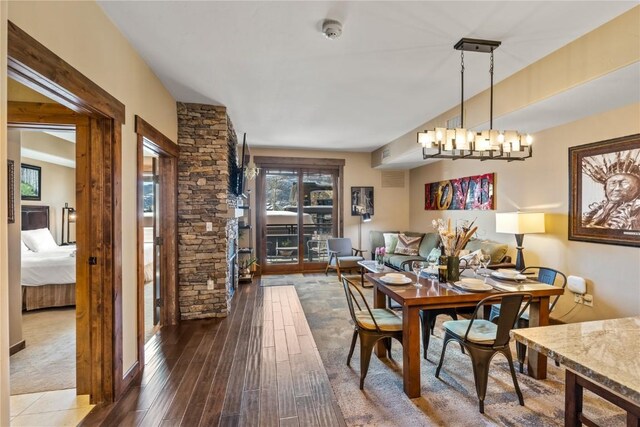 1175 Bangtail Way Unit 2110, Steamboat Springs, CO 80487 - dining room with dark wood-type flooring and a notable chandelier