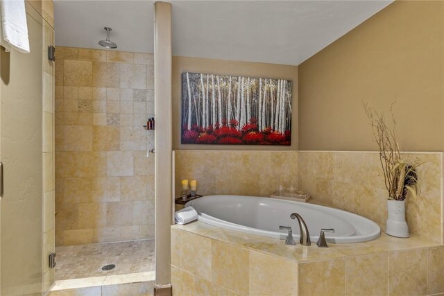 full bath featuring a garden tub and a stall shower