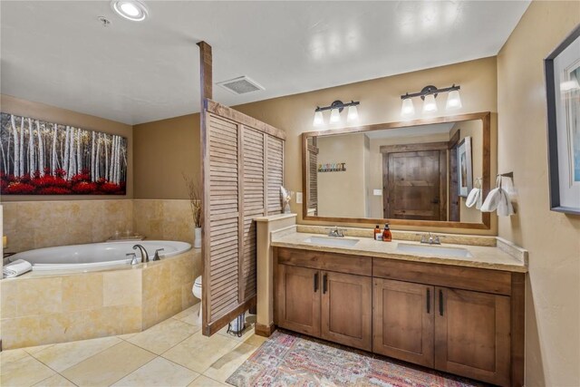 1175 Bangtail Way Unit 2110, Steamboat Springs, CO 80487 - bathroom with a bath, tile patterned floors, a sink, and visible vents
